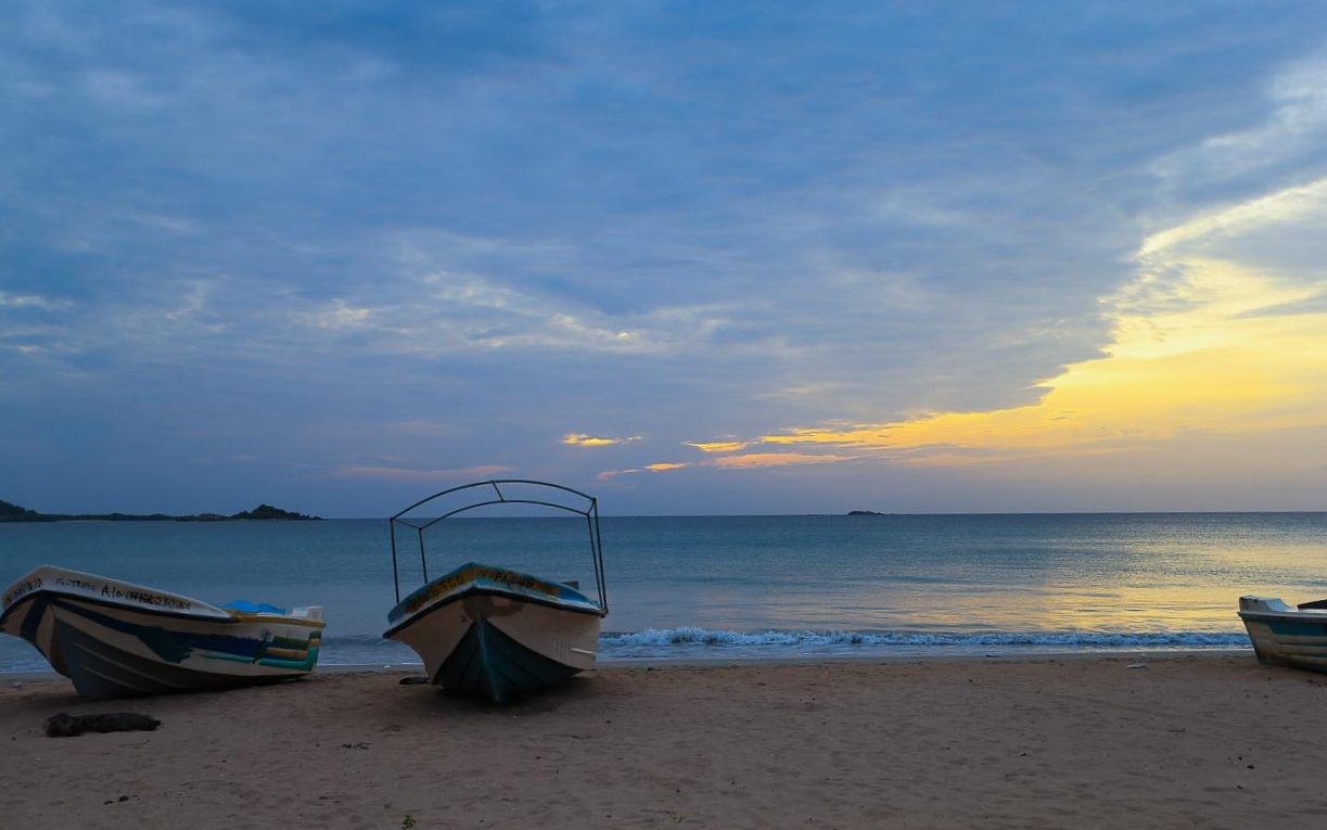 boats sunset beach Trincomalee sri lanka