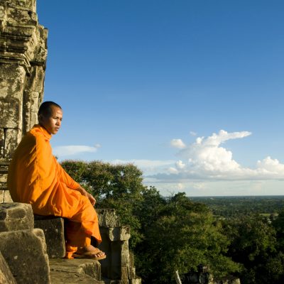 monk by temple siem reap cambodia
