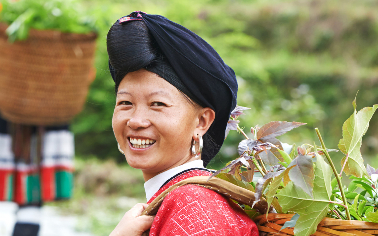 Chinese Tribe Lady carrying a basket